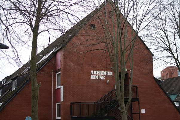 A close up of a red brick building

Description automatically generated